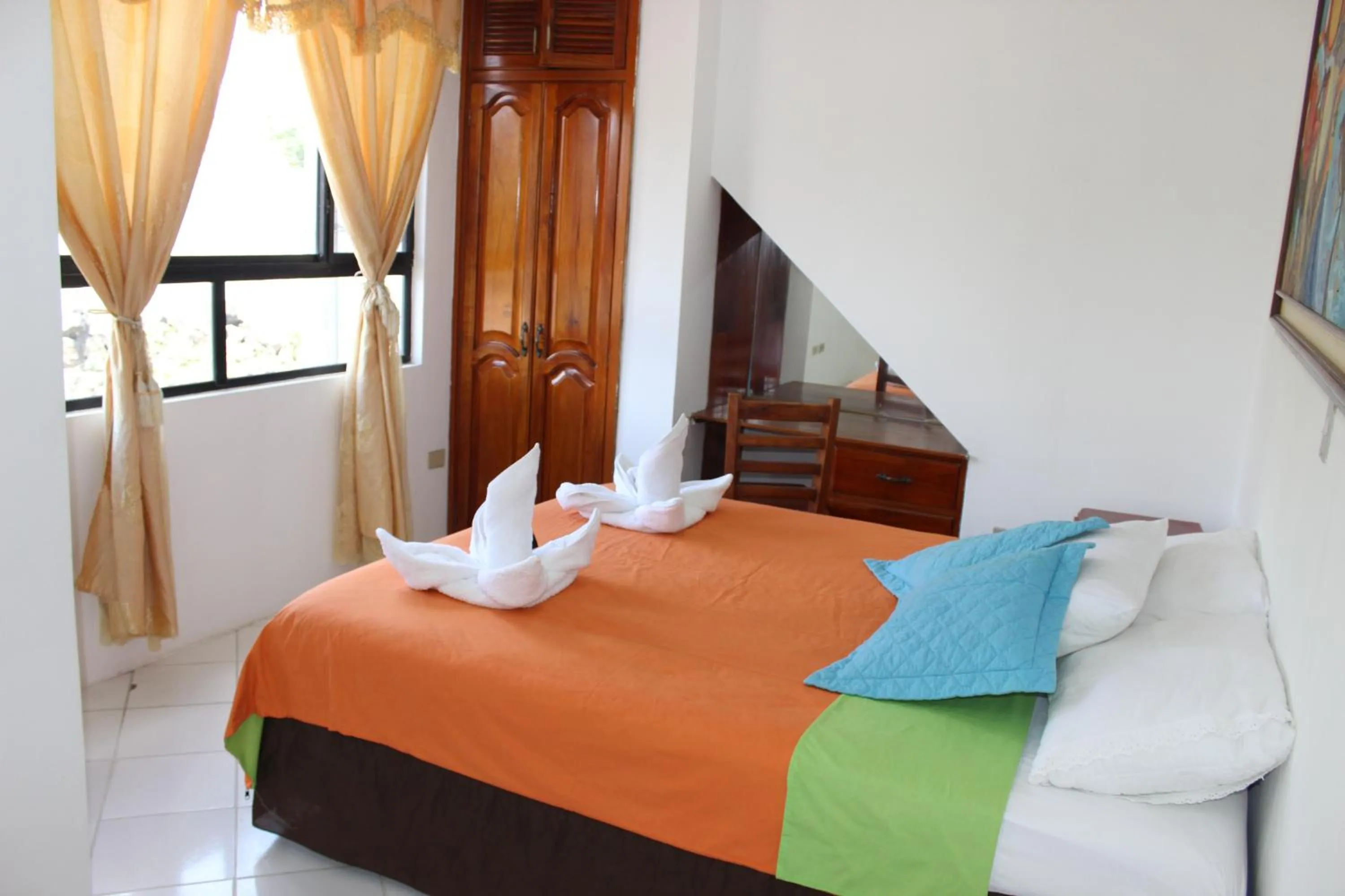 Photo of the whole room, Bed in The Island Home