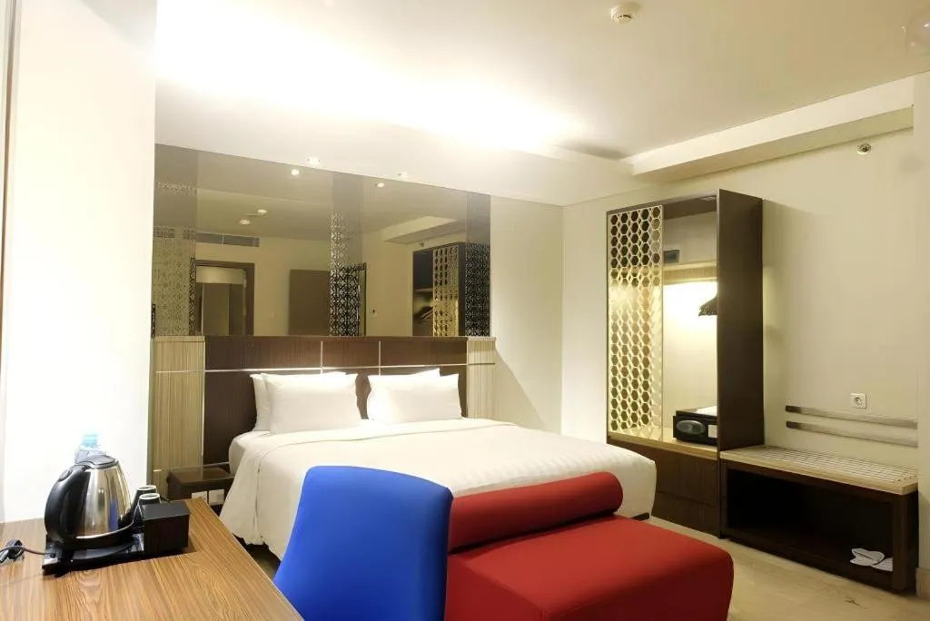 Bed in CLARO Makassar Hotel & Convention