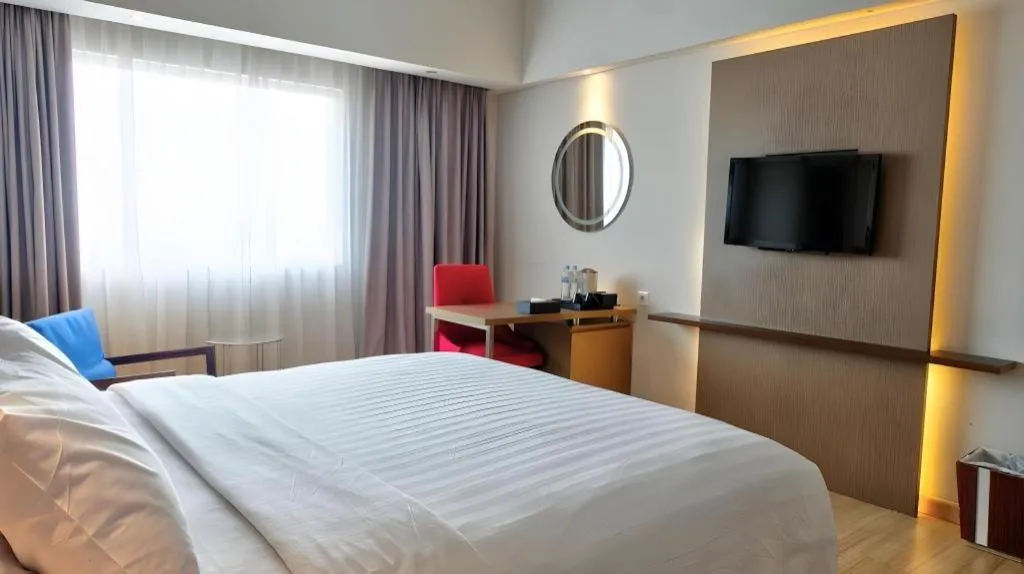 Bed in CLARO Makassar Hotel & Convention