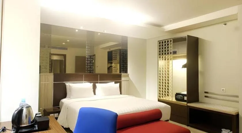 Bed in CLARO Makassar Hotel & Convention