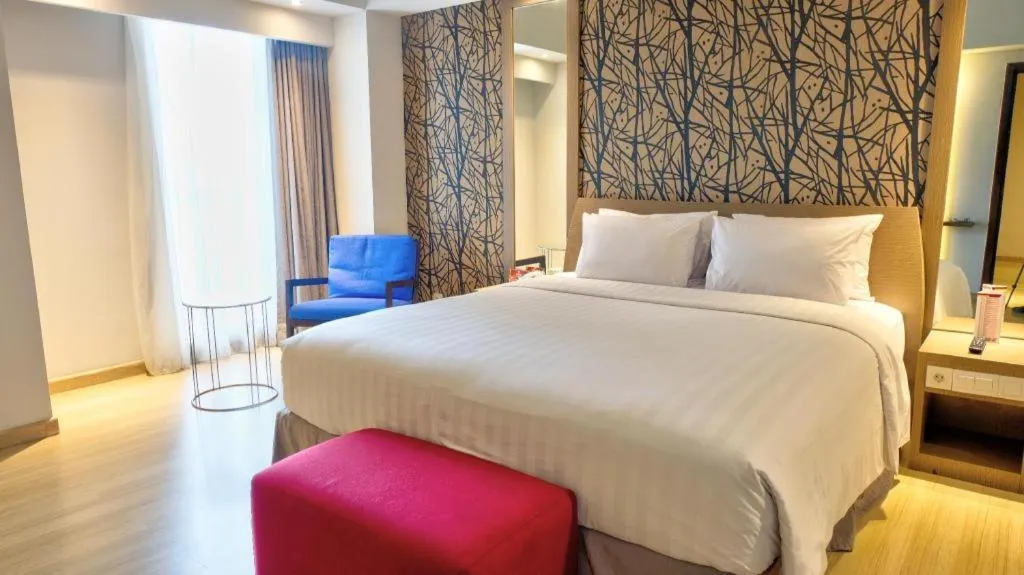 Bed in CLARO Makassar Hotel & Convention