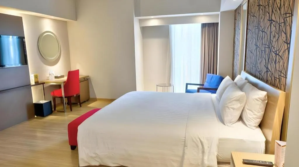 Bed in CLARO Makassar Hotel & Convention