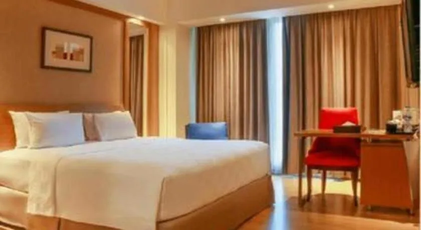 Bed in CLARO Makassar Hotel & Convention