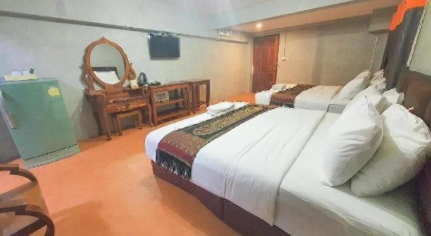 Bed in Jirawan Hotel