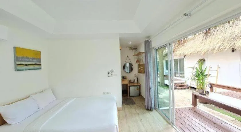 Bed in Sawasdee Coco Resort