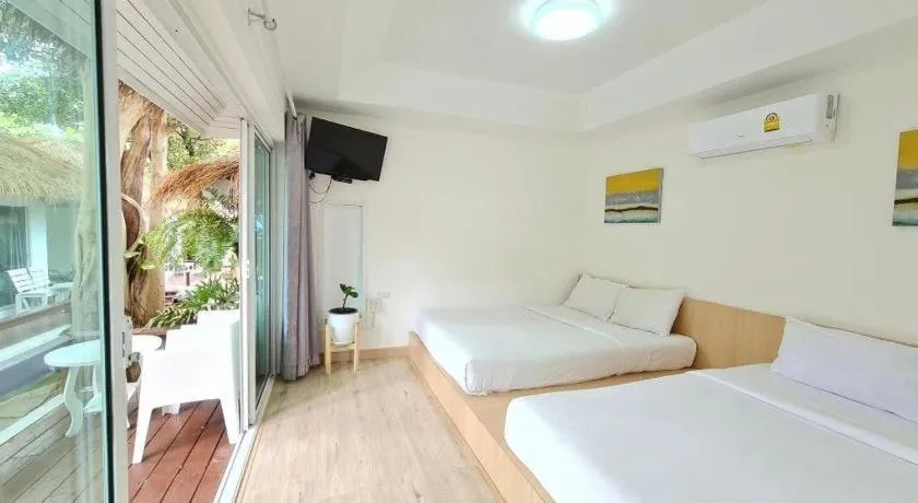 Bed in Sawasdee Coco Resort