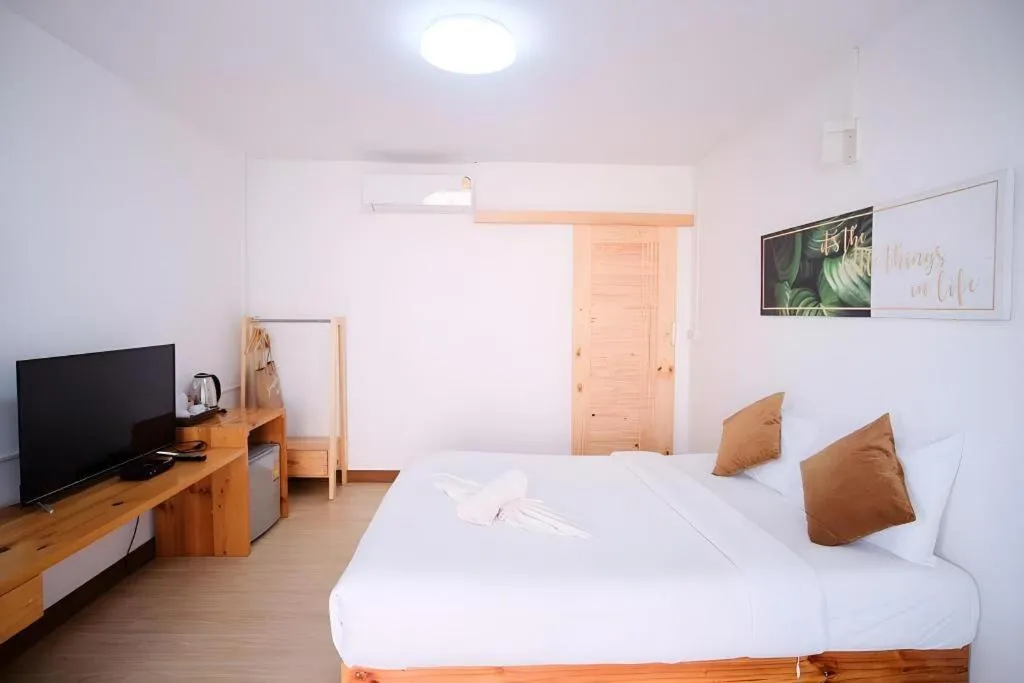 Bed in Sawasdee Coco Resort