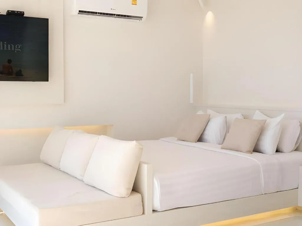 Bed in Sawasdee Coco Resort