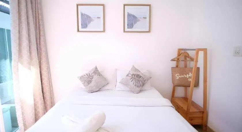 Bed in Sawasdee Coco Resort