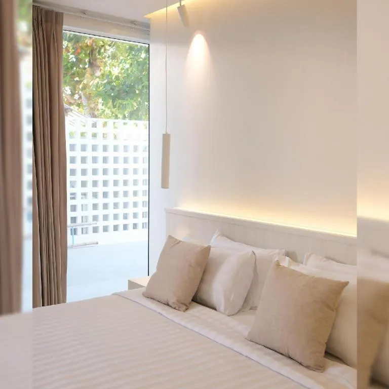 Bed in Sawasdee Coco Resort