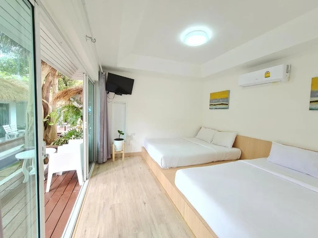 Bed in Sawasdee Coco Resort