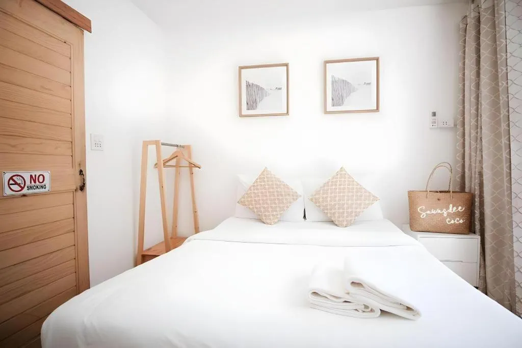 Bed in Sawasdee Coco Resort