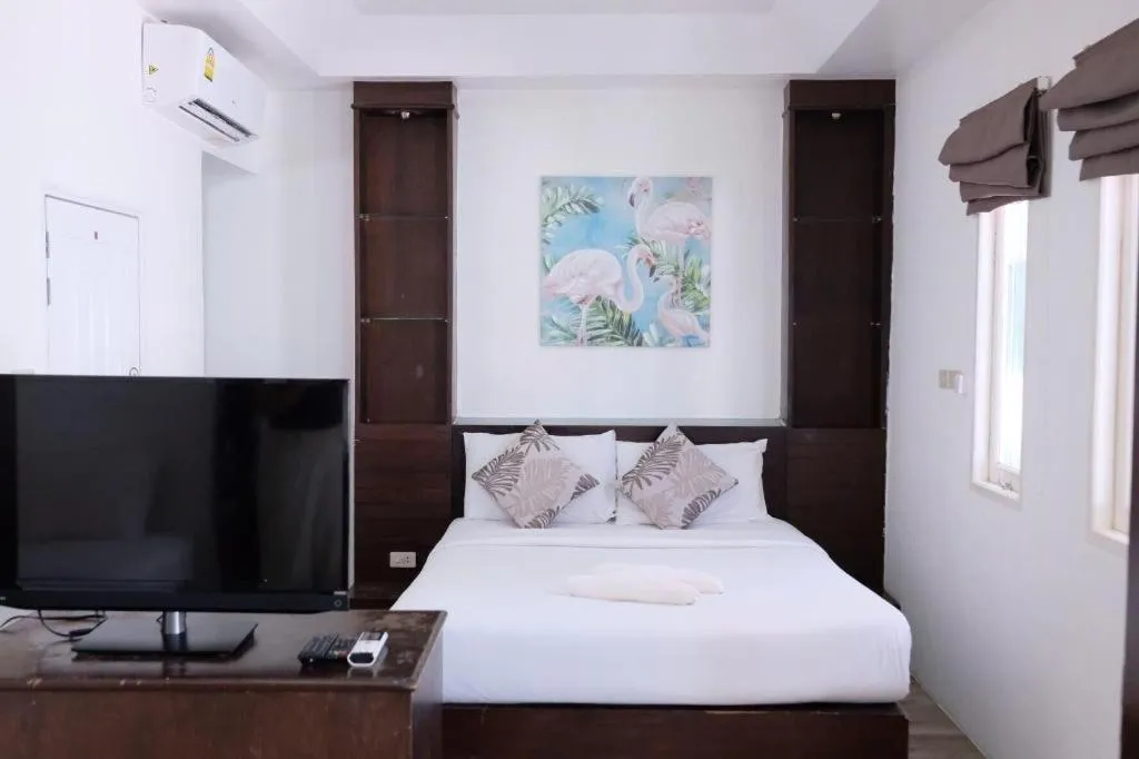 Bed in Sawasdee Coco Resort