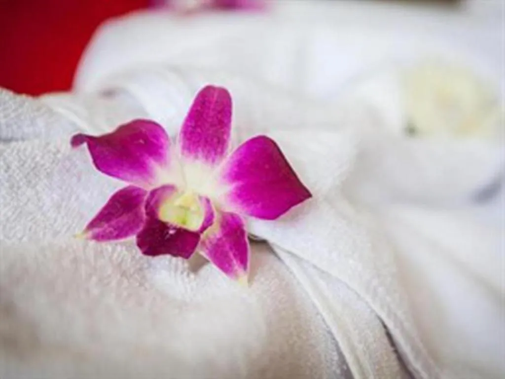 Bed in Triple Rund Place Hotel