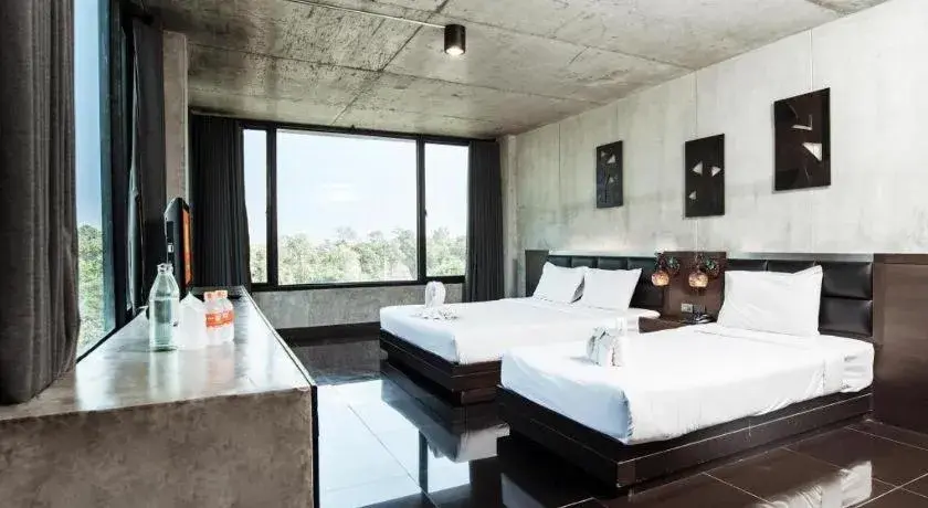 Bed in B2 Black Business and Budget Hotel Bed in B2 Black Business and Budget Hotel