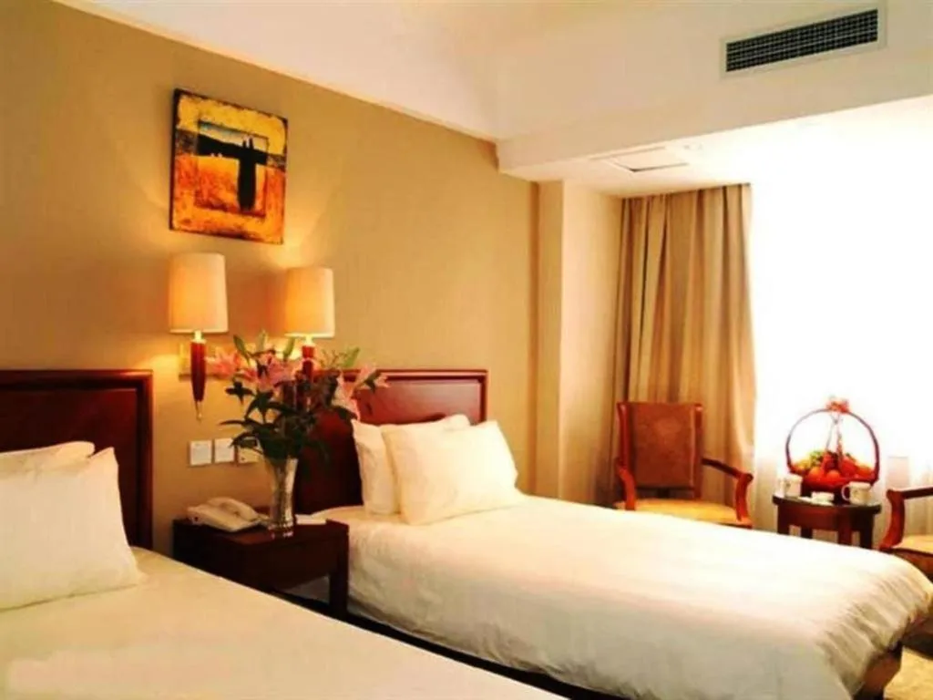 Bed in GreenTree Inn Suites HongQiao Airport Branch
