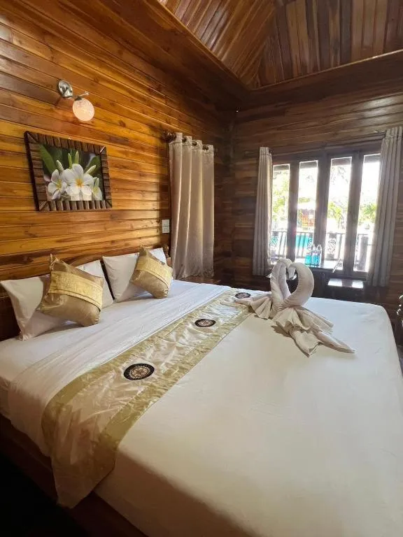 Bed in Srisawat Resort