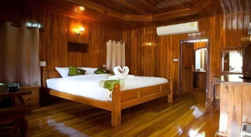 Bed in Srisawat Resort