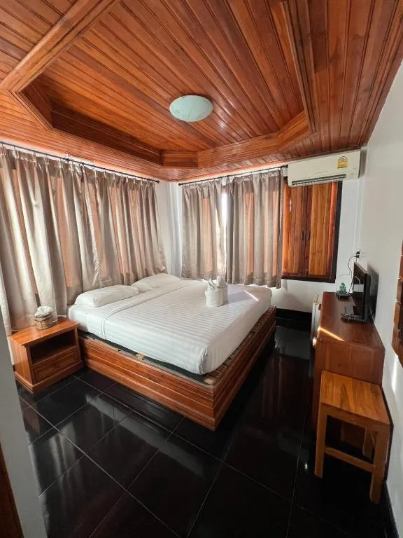 Bed in Srisawat Resort