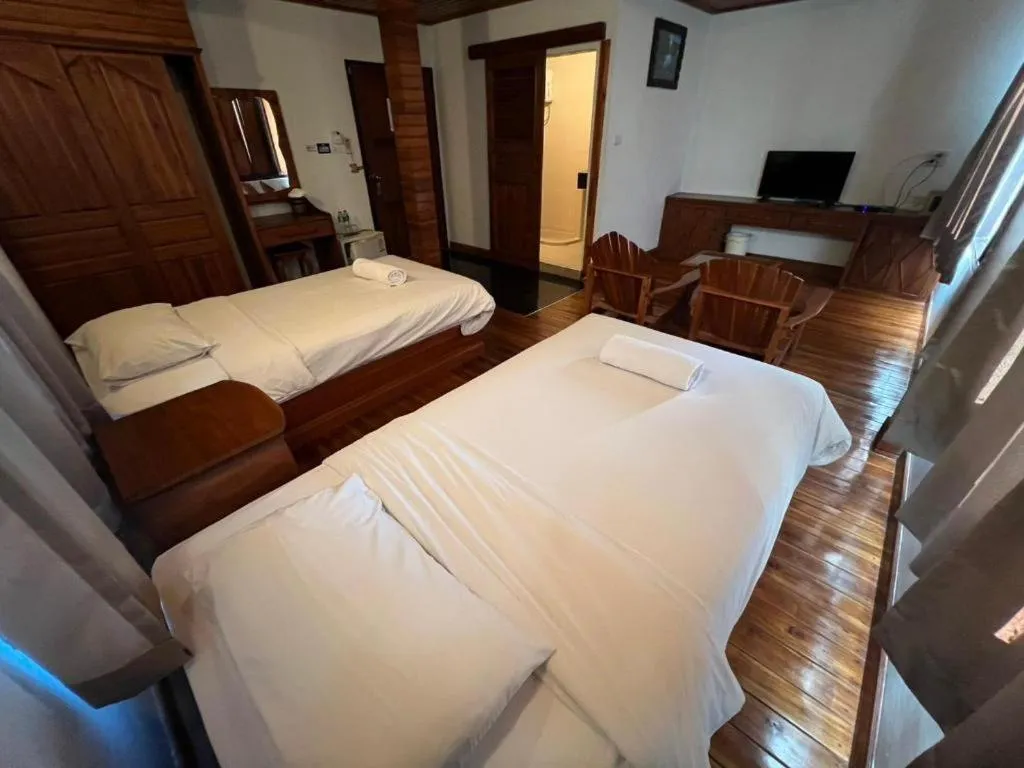 Bed in Srisawat Resort