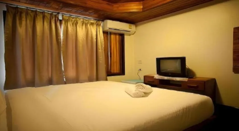 Bed in Srisawat Resort