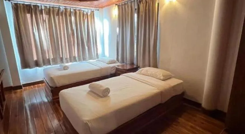 Bed in Srisawat Resort