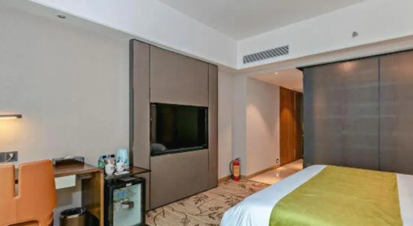 Bed in New Pearl River Hotel