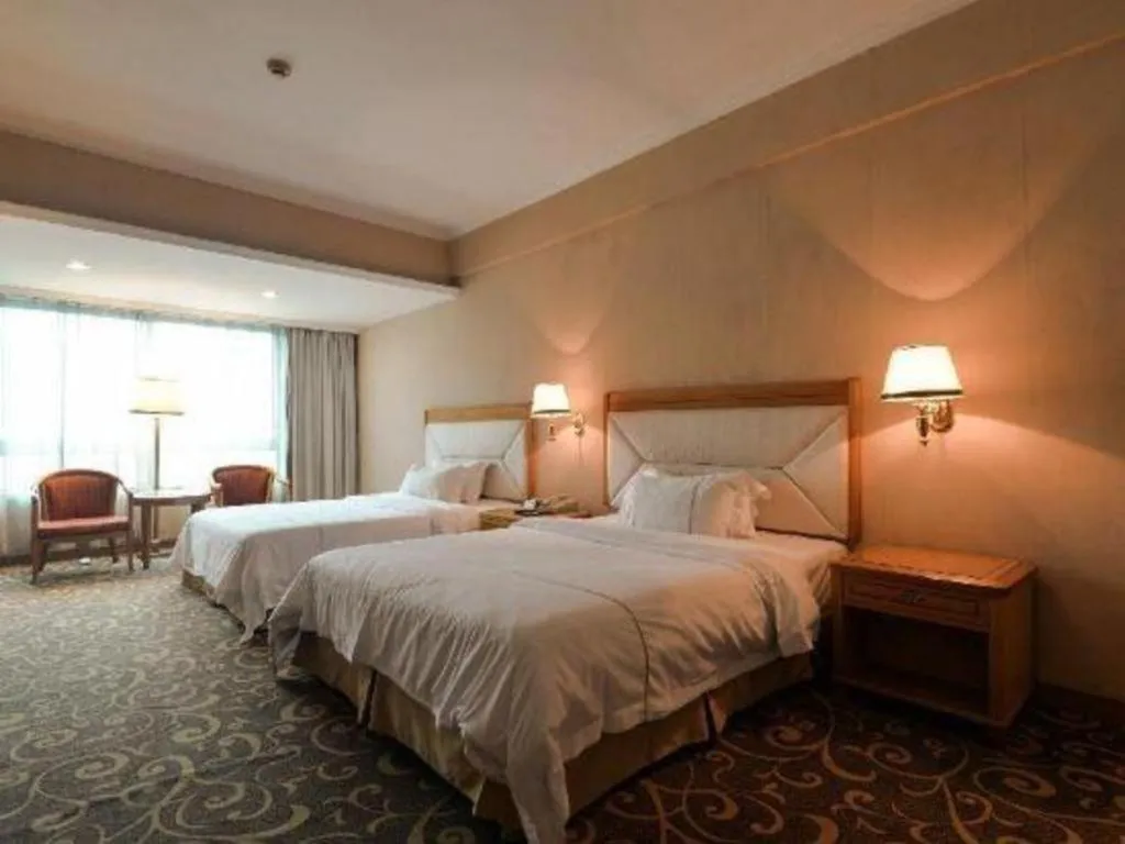 Bed in New Pearl River Hotel