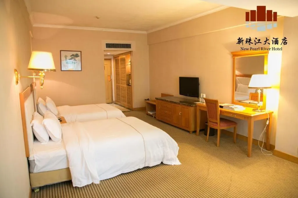 Bed in New Pearl River Hotel