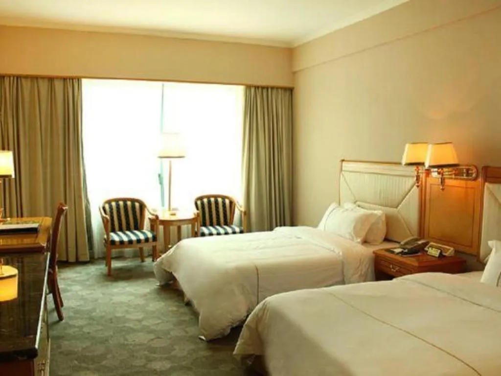 Bed in New Pearl River Hotel