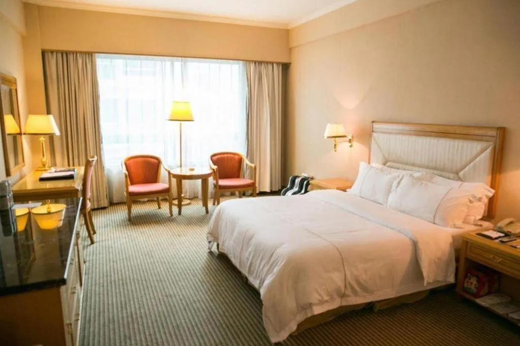 Bed in New Pearl River Hotel