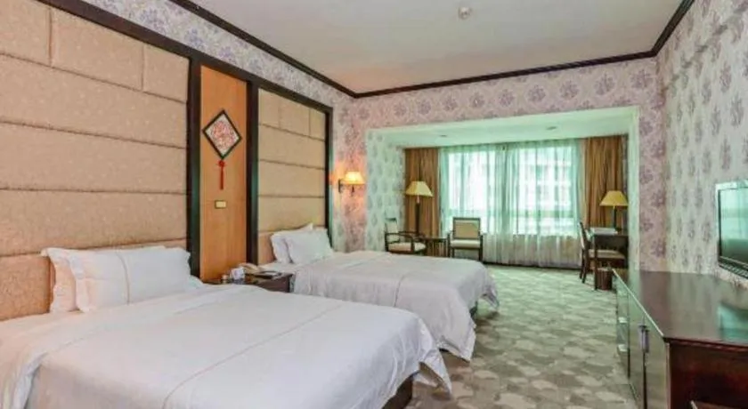 Bed in New Pearl River Hotel