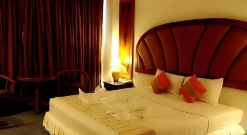 Bed in Thepnakorn Hotel