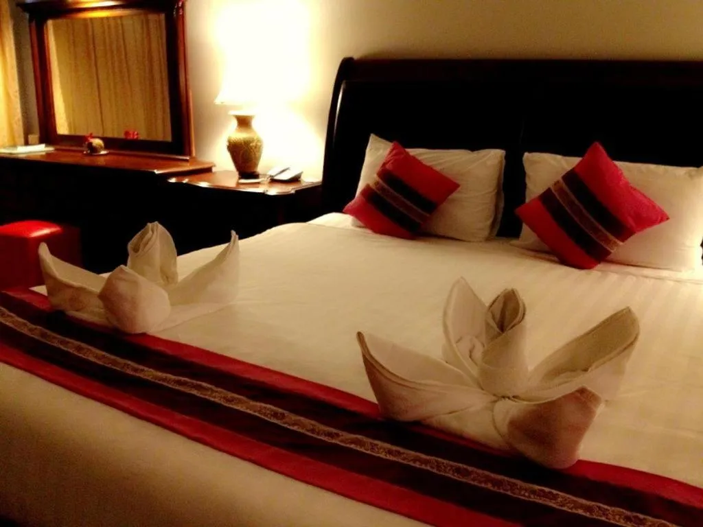 Bed in Thepnakorn Hotel