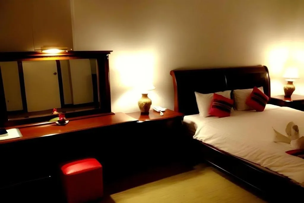 Bed in Thepnakorn Hotel