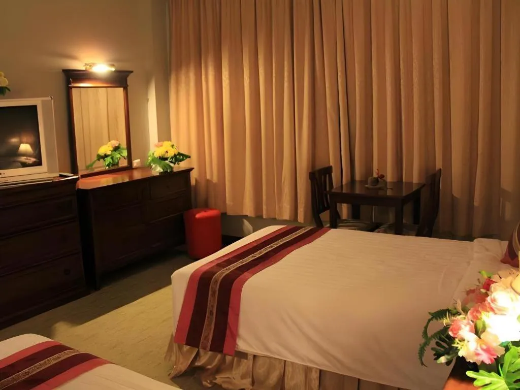 Bed in Thepnakorn Hotel