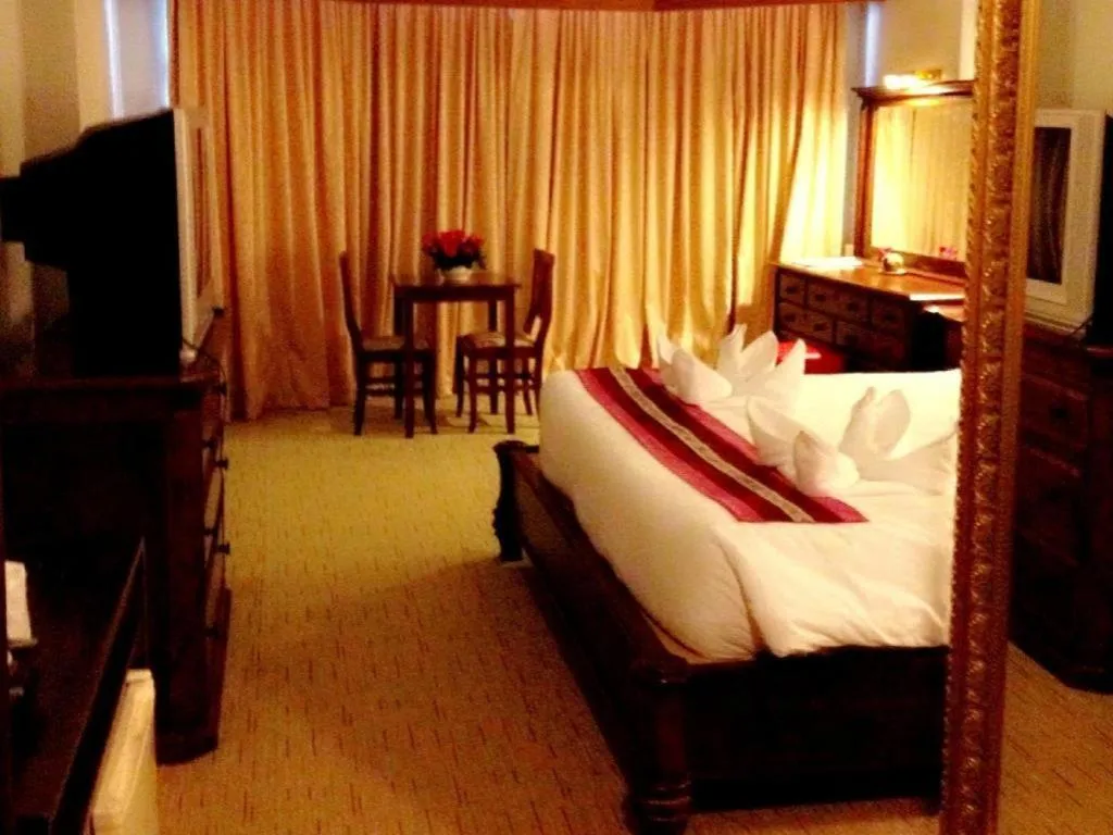Bed in Thepnakorn Hotel