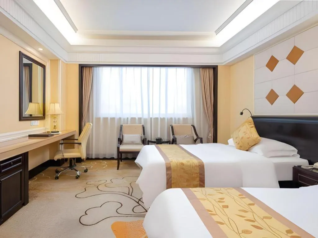 Bed in Sun City Hotel Haikou