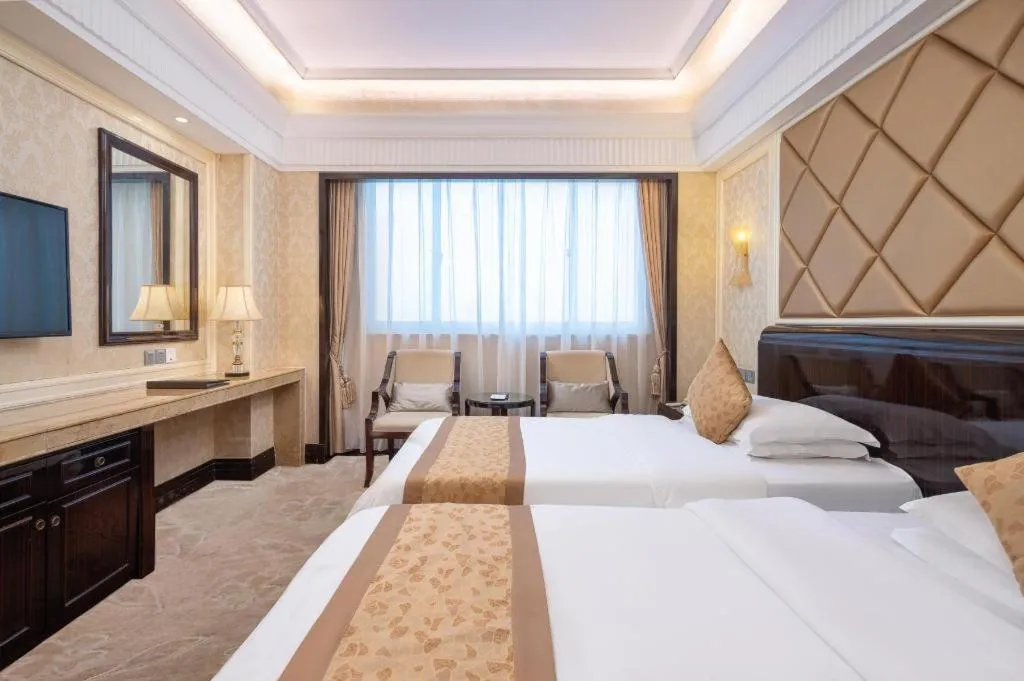 Bed in Sun City Hotel Haikou