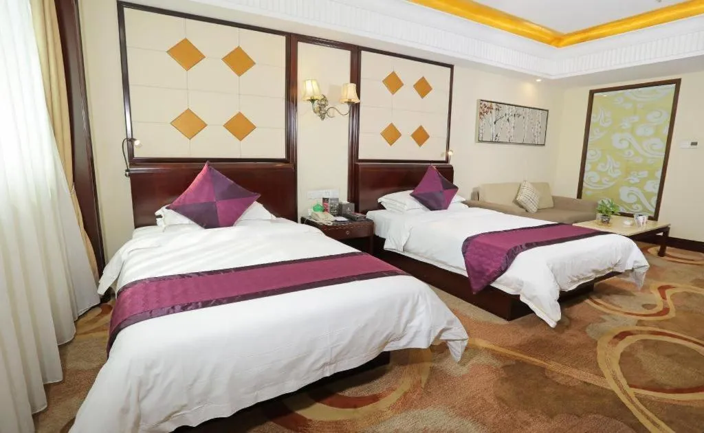Bed in Sun City Hotel Haikou