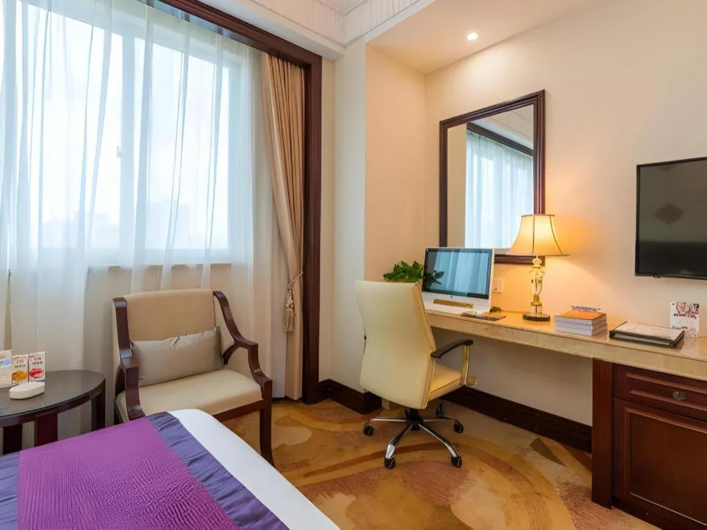 Bed in Sun City Hotel Haikou