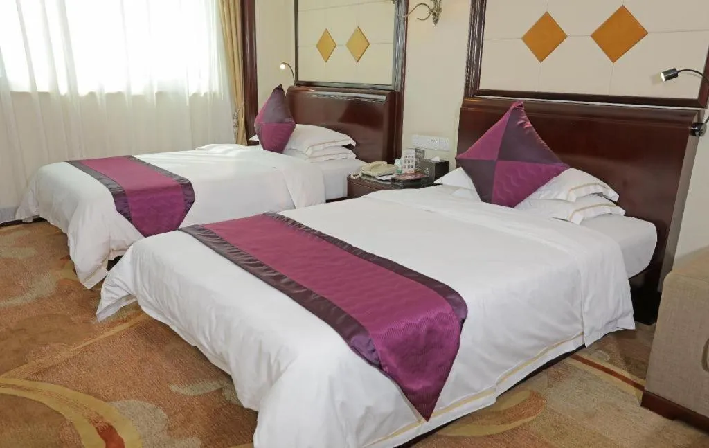 Bed in Sun City Hotel Haikou