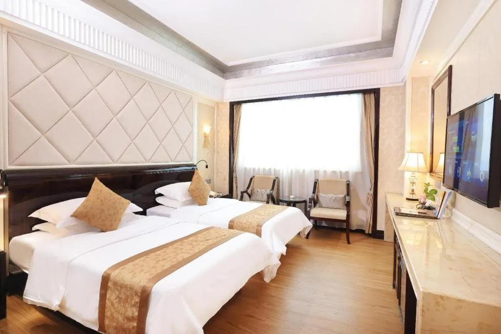 Bed in Sun City Hotel Haikou
