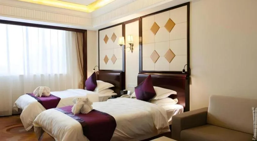 Bed in Sun City Hotel Haikou