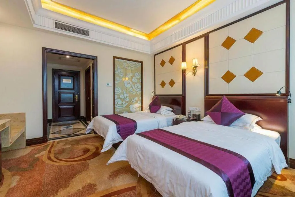 Bed in Sun City Hotel Haikou