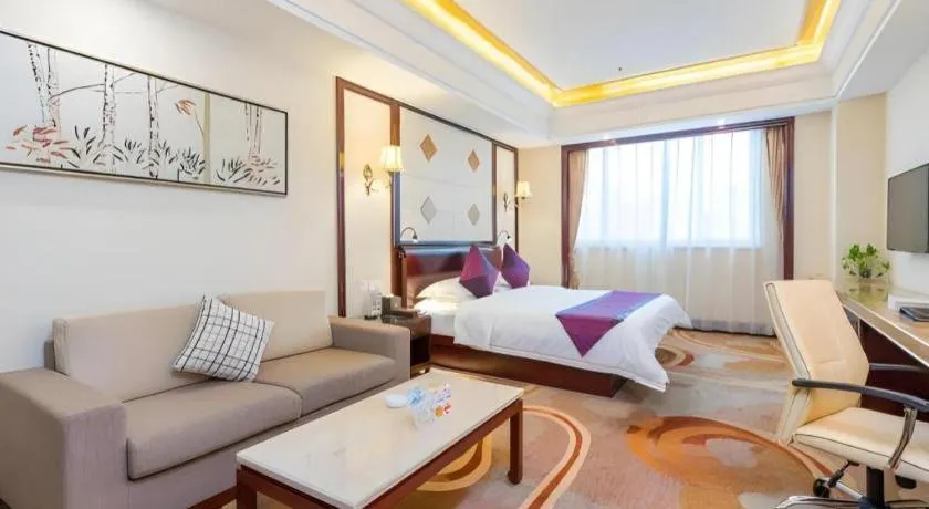 Bed in Sun City Hotel Haikou