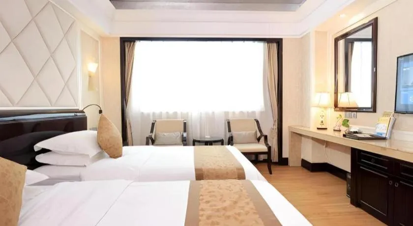 Bed in Sun City Hotel Haikou