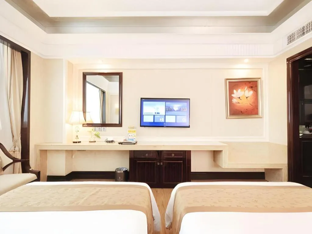 Bed in Sun City Hotel Haikou