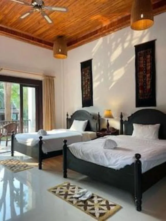 Bed in Nam Ou Riverside Resort