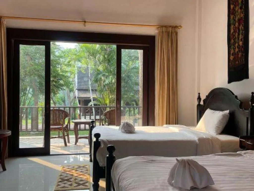 Bed in Nam Ou Riverside Resort